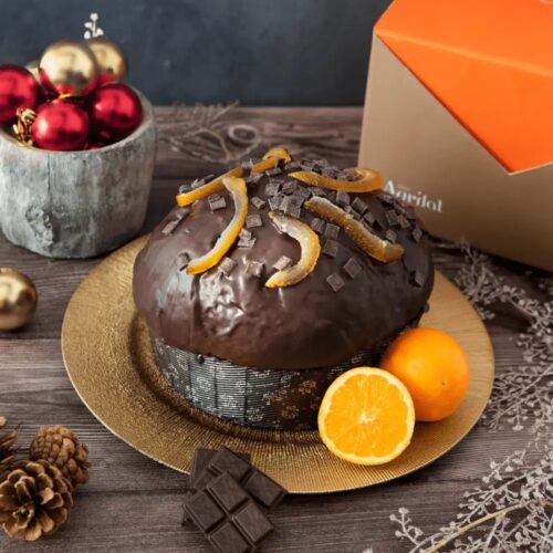 panettone with dark chocolate, orange and rum on plate